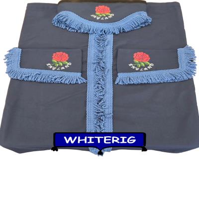 Stylish navy blue truck curtains finished with bold blue fringe trim and embroidered red England rose detailing. A clean, patriotic upgrade for your truck cab interior. Whiterig Truck Curtains